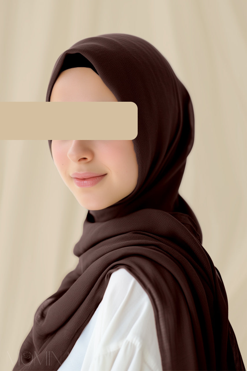 Model wearing a dark brown modal hijab from momina hijabs