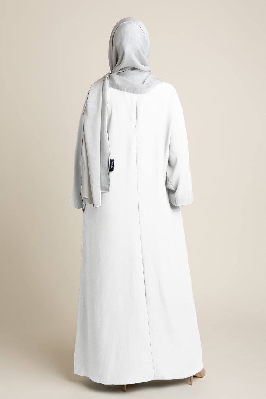 Model wearing a classic Abaya with side pockets in a white color - Rear pose - Momina Hijabs