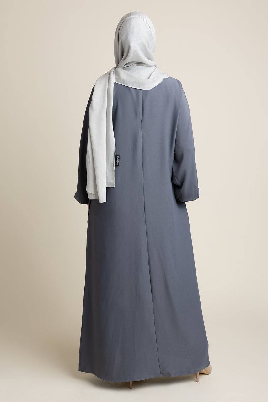 Model wearing a classic Abaya with side pockets in a gray color - Rear pose - Momina Hijabs