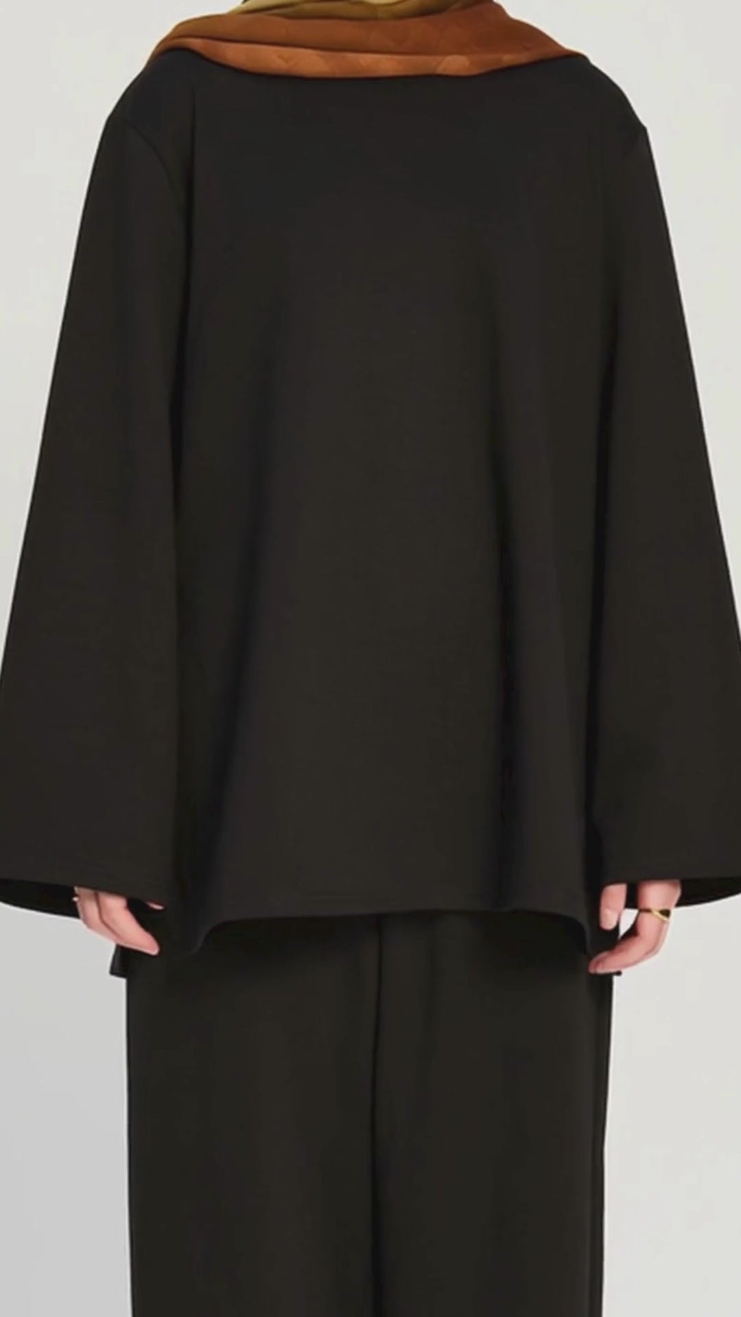 Model wearing the Raha Lounge Top in Brew by Momina Hijabs