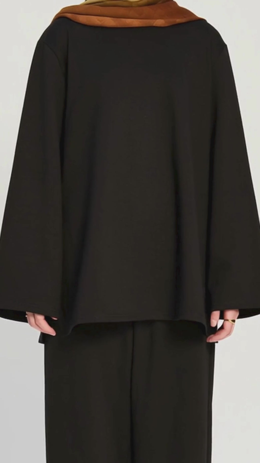 Model wearing the Raha Lounge Top in Brew by Momina Hijabs